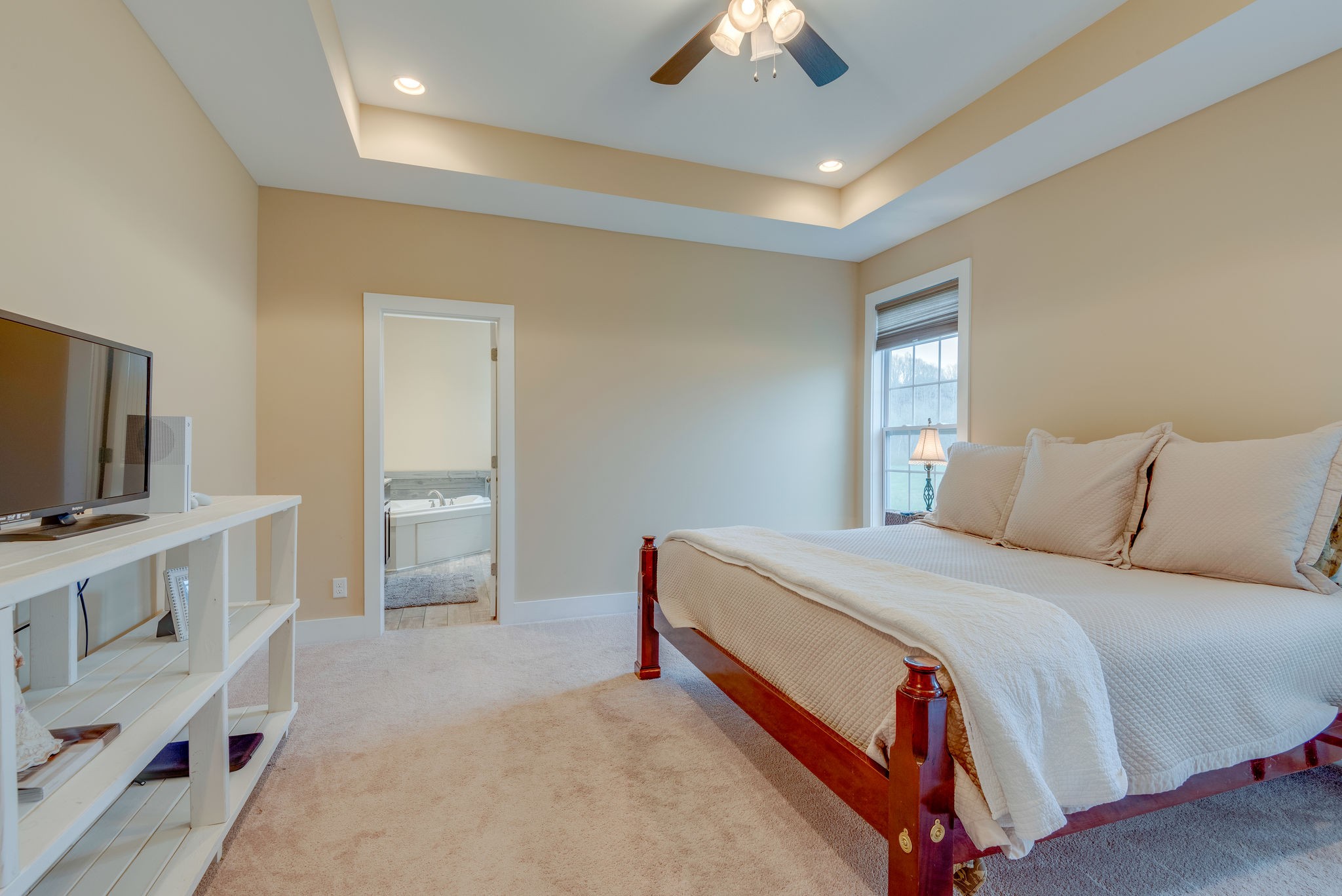 872 Tidwell Road Burns, TN 37029 - Photo 16 of 26 a bed room with a bed and a television