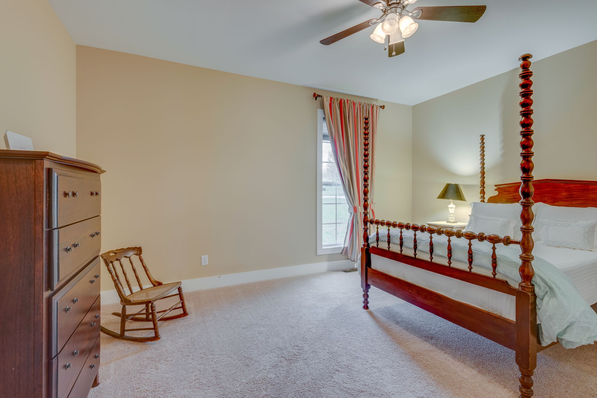 872 Tidwell Road Burns, TN 37029 - Photo 20 of 26 a bedroom with furniture and a chandelier
