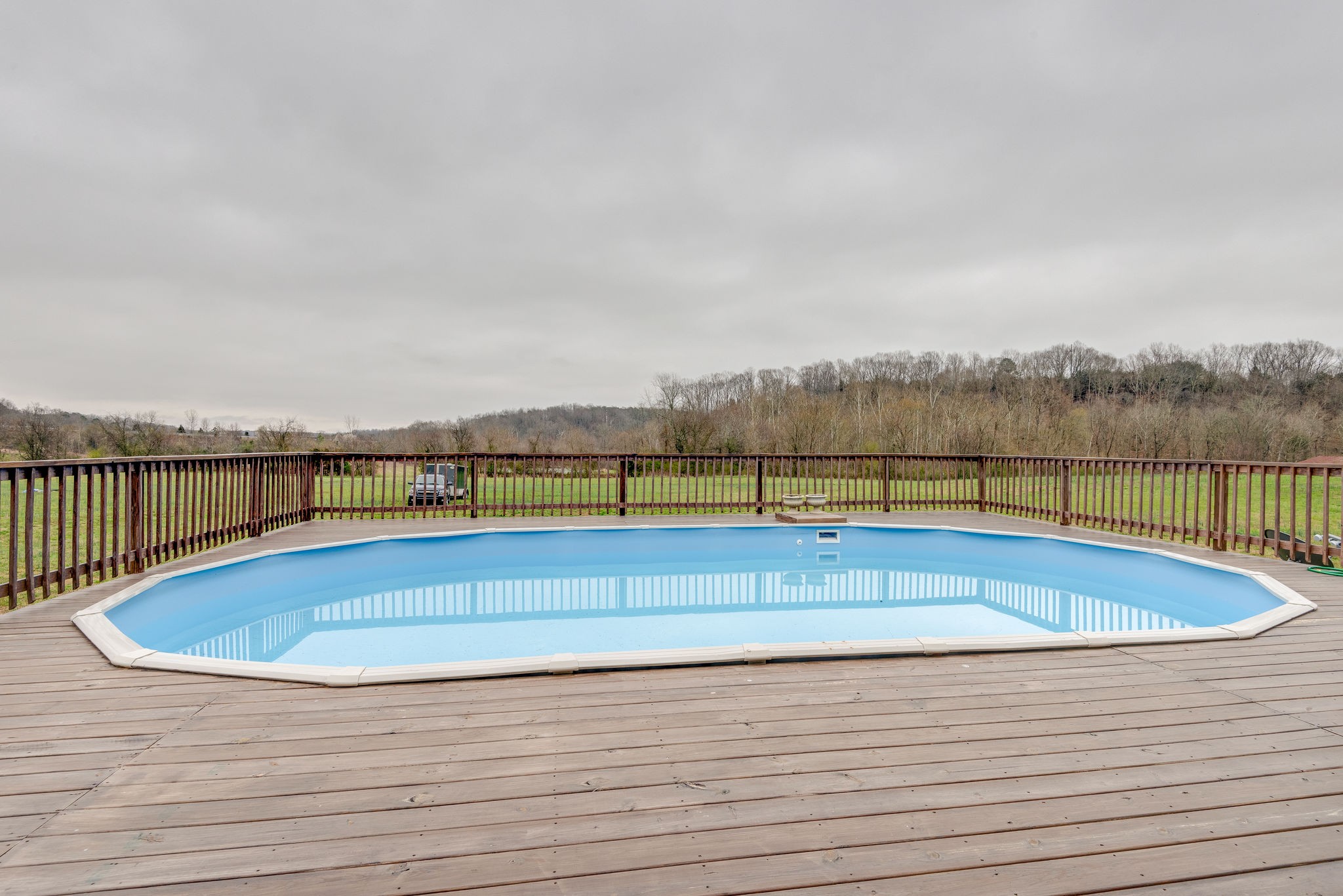872 Tidwell Road Burns, TN 37029 - Photo 25 of 26 a view of swimming pool with lake and houses in the back