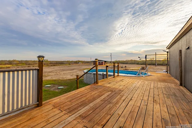 a balcony with wooden floor