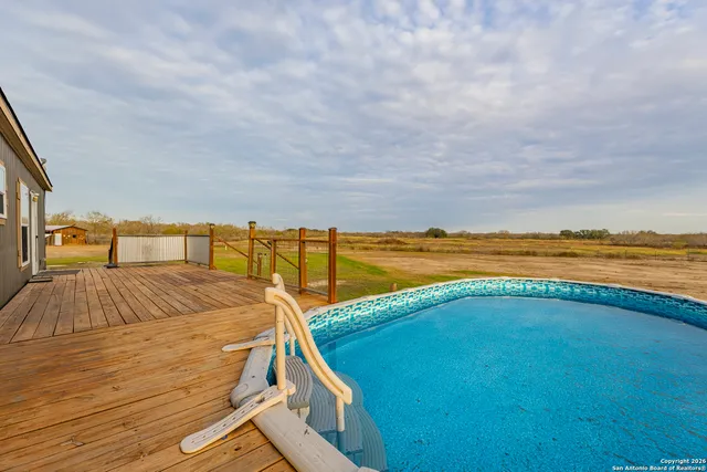 a view of a swimming pool with an ocean view