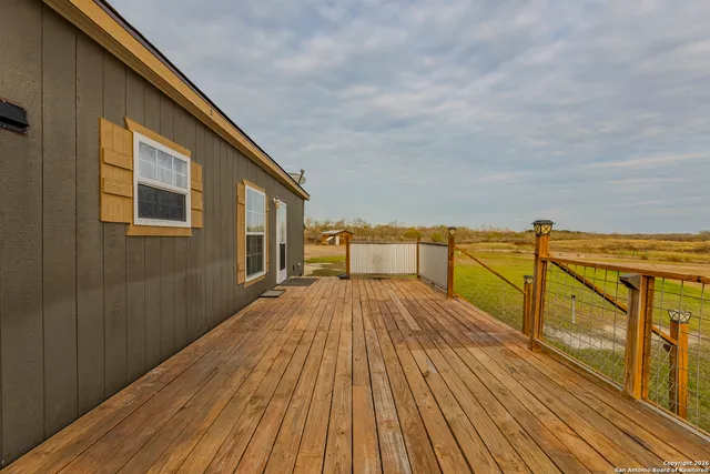 a house view with swimming pool in front of it
