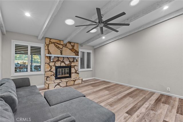 a view of a livingroom with a couch and a window