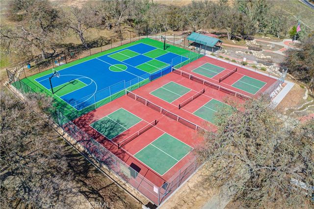 a view of a chairs and table in the patio