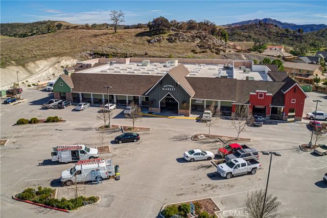 an aerial view of a house with a lake view