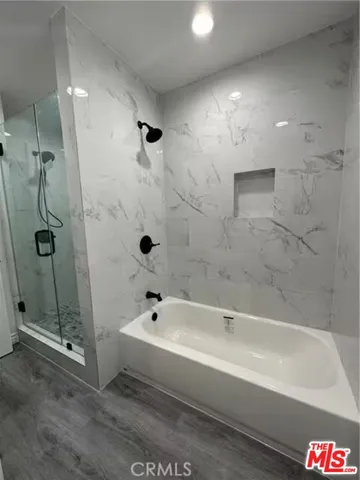 a kitchen with granite countertop a stove top oven sink and cabinets