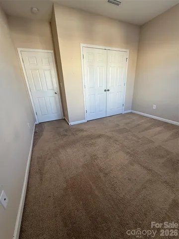 an empty room with mirror