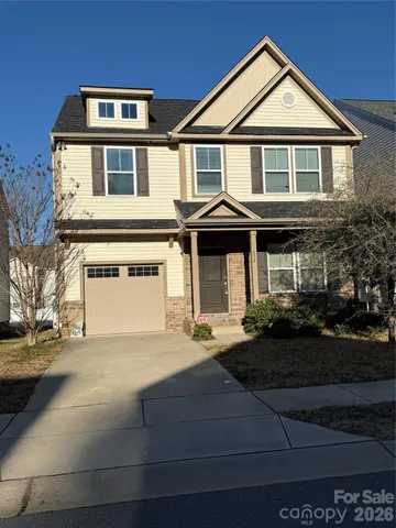 a front view of a house with garage