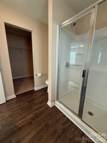 a view of front door with wooden floor