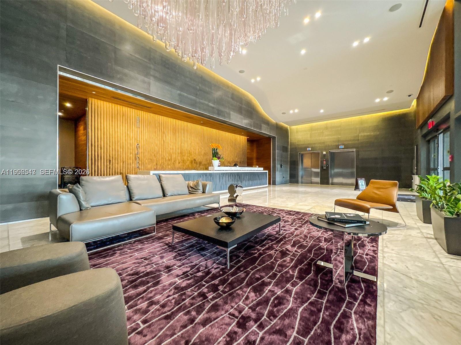 88 Southwest 7th Street, Unit 2104 Miami, FL 33130 - Photo 25 of 50 a living room with couch and a large window