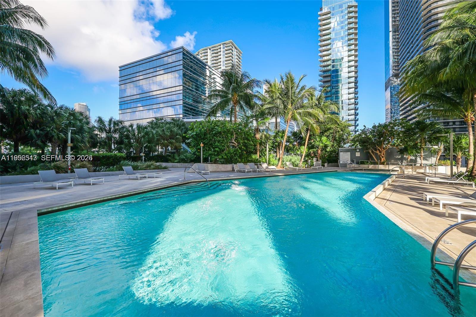 88 Southwest 7th Street, Unit 2104 Miami, FL 33130 - Photo 27 of 50 a view of a swimming pool with a yard