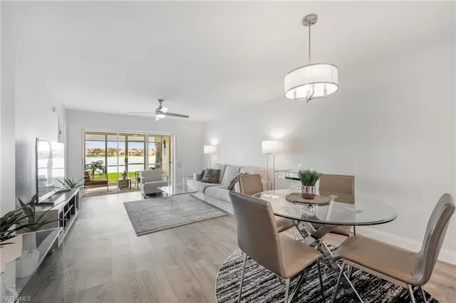 a kitchen with white cabinets appliances and a sink