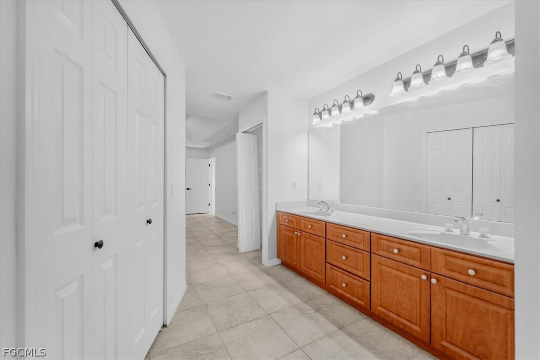 430 South Datil Street Clewiston, FL 33440 - Photo 19 of 33 a spacious bathroom with a double vanity sink mirror and
