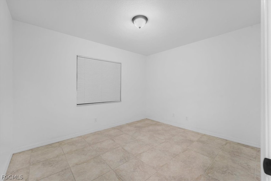 430 South Datil Street Clewiston, FL 33440 - Photo 23 of 33 an empty room with windows
