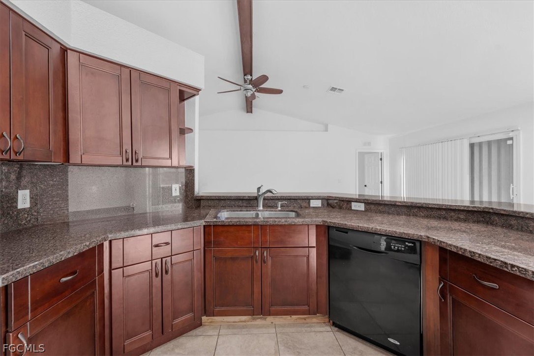 430 South Datil Street Clewiston, FL 33440 - Photo 10 of 33 a kitchen with stainless steel appliances granite countertop a sink stove and cabinets