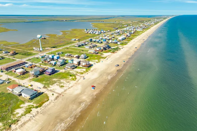 a view of an ocean and a houses