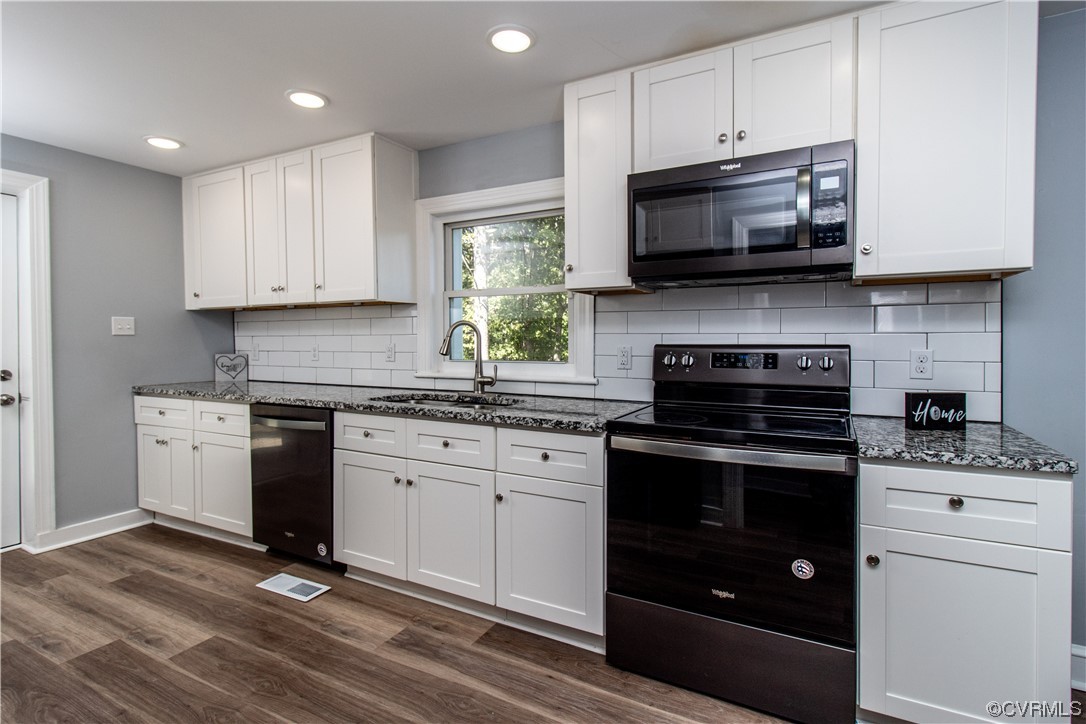2125 Burgess Road Chester, VA 23836 - Photo 12 of 39 a kitchen with stainless steel appliances granite countertop a stove a sink and a microwave