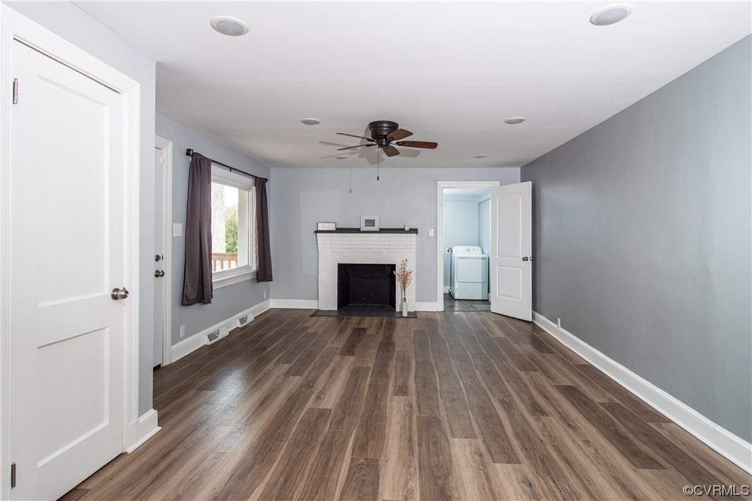 2125 Burgess Road Chester, VA 23836 - Photo 3 of 39 wooden floor fireplace and natural light in empty room