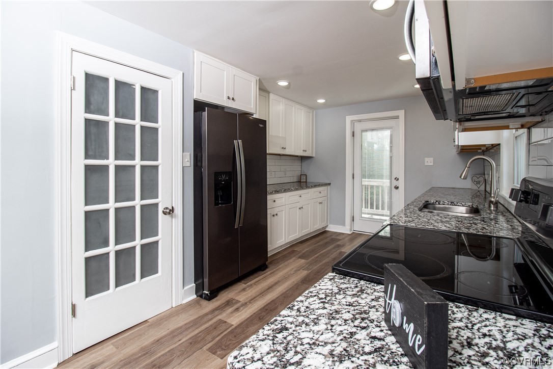 2125 Burgess Road Chester, VA 23836 - Photo 10 of 39 a kitchen with a refrigerator and a sink