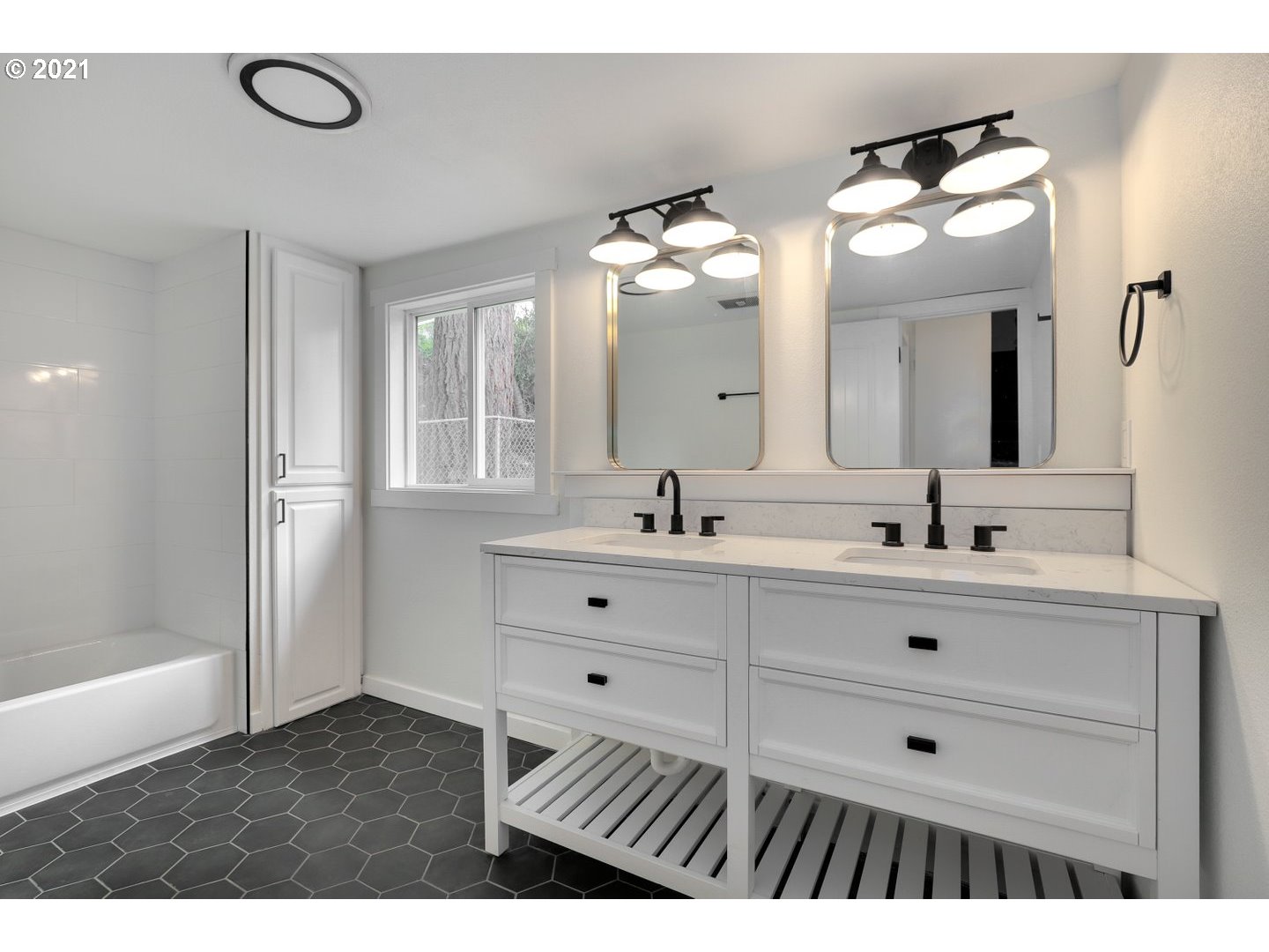 817 Highland Street Ridgefield, WA 98642 - Photo 15 of 27 a bathroom with a double vanity sink mirror and bathtub