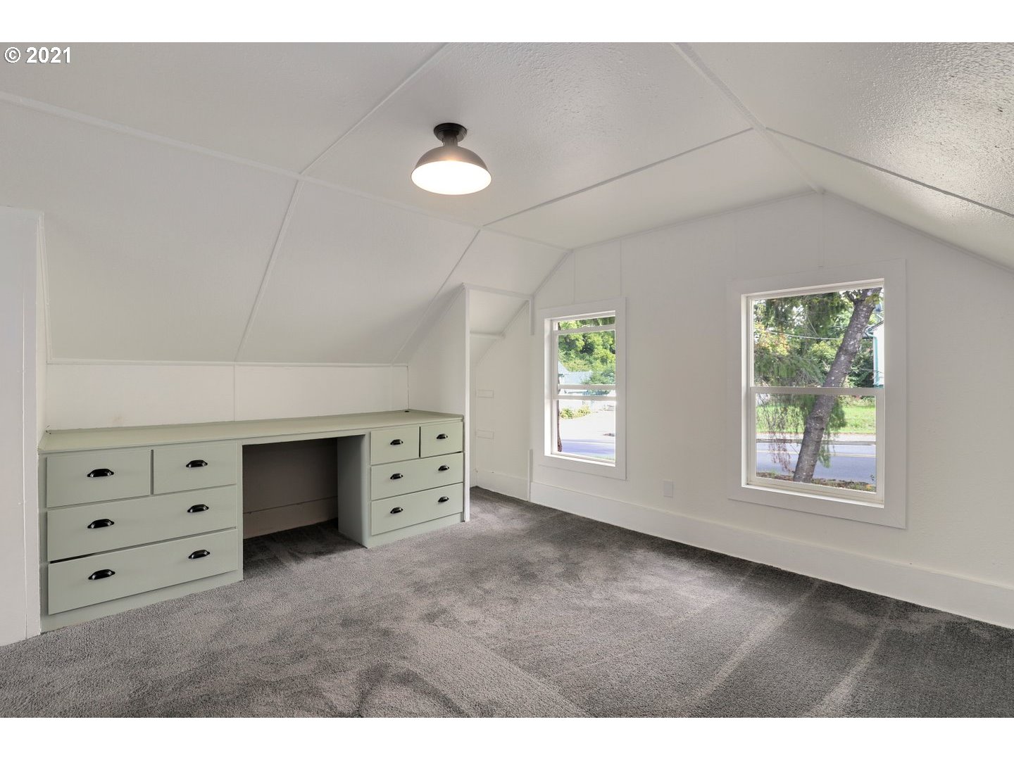 817 Highland Street Ridgefield, WA 98642 - Photo 18 of 27 a view of room with cabinet and windows