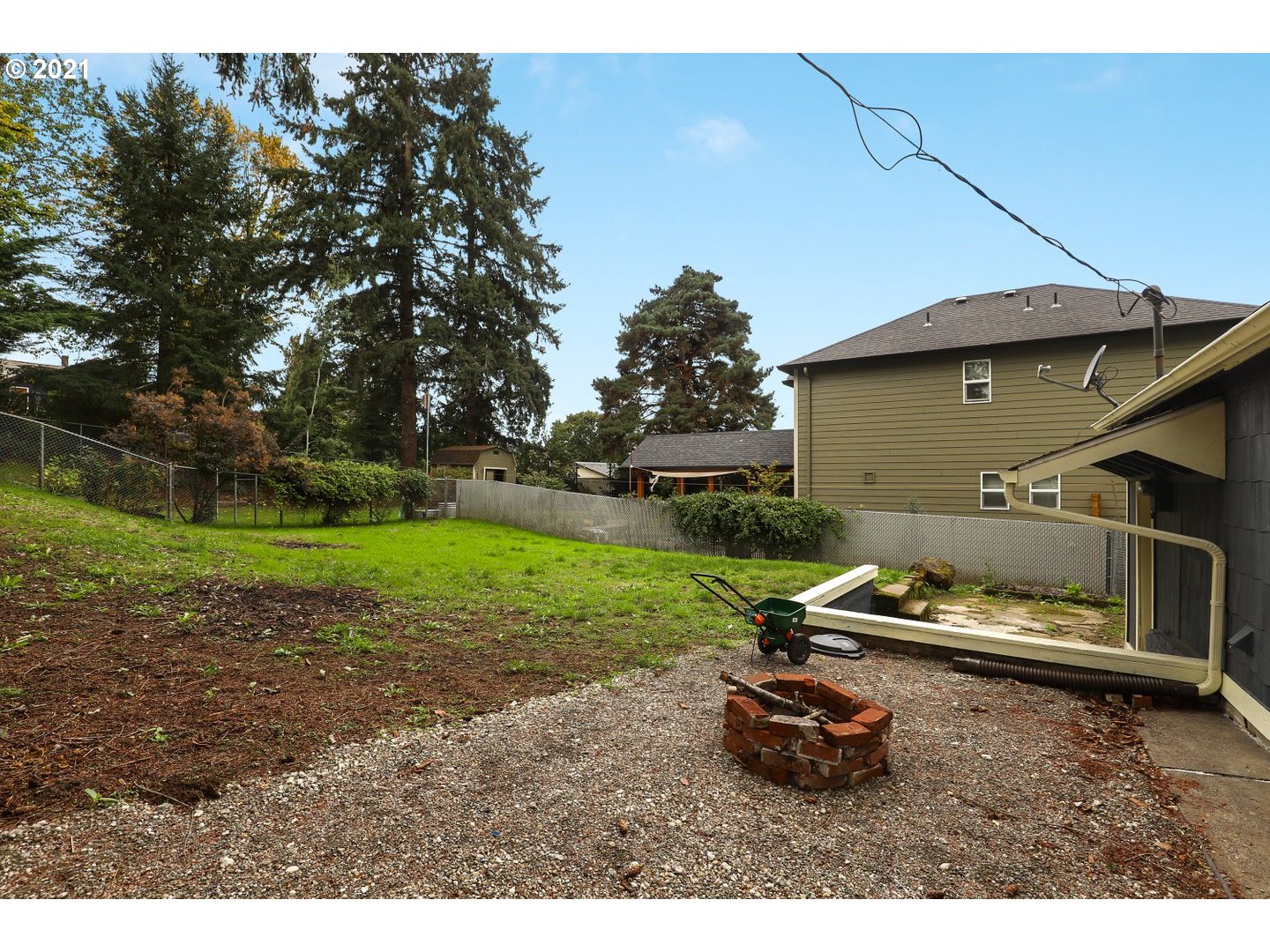 817 Highland Street Ridgefield, WA 98642 - Photo 25 of 27 a backyard of a house with table and chairs
