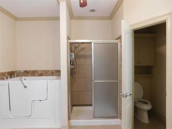 a bathroom with a glass shower door