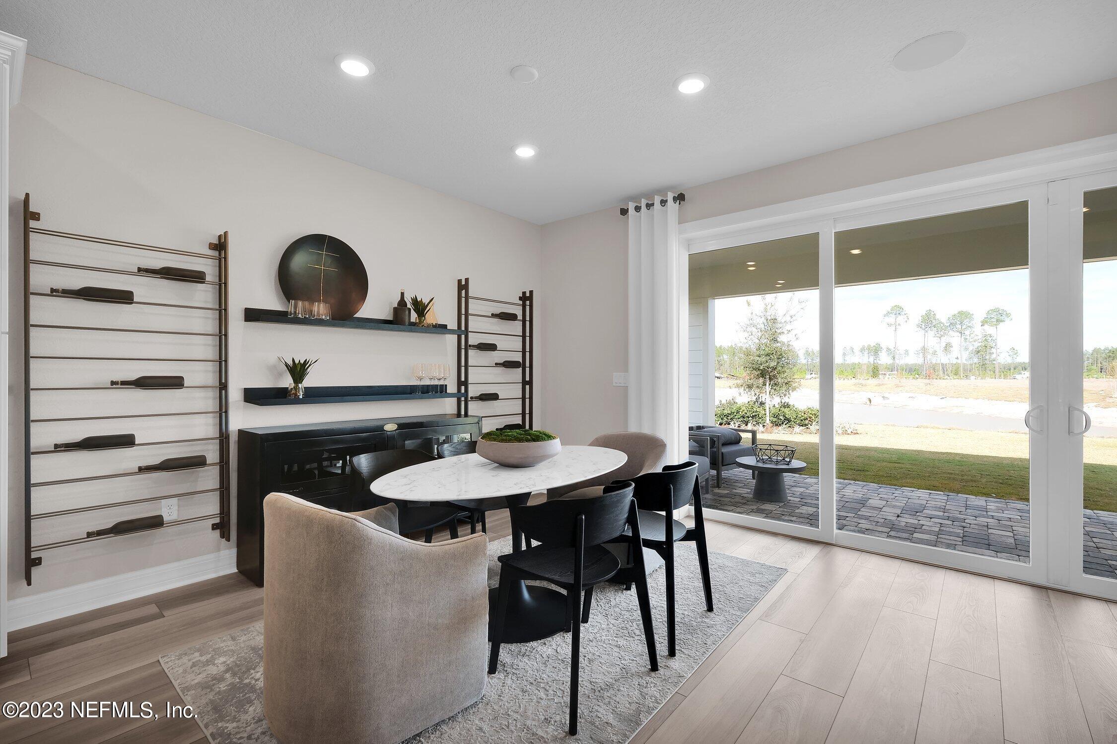 306 Shortleaf Lane Yulee, FL 32097 - Photo 13 of 35 a dining room with furniture and wooden floor