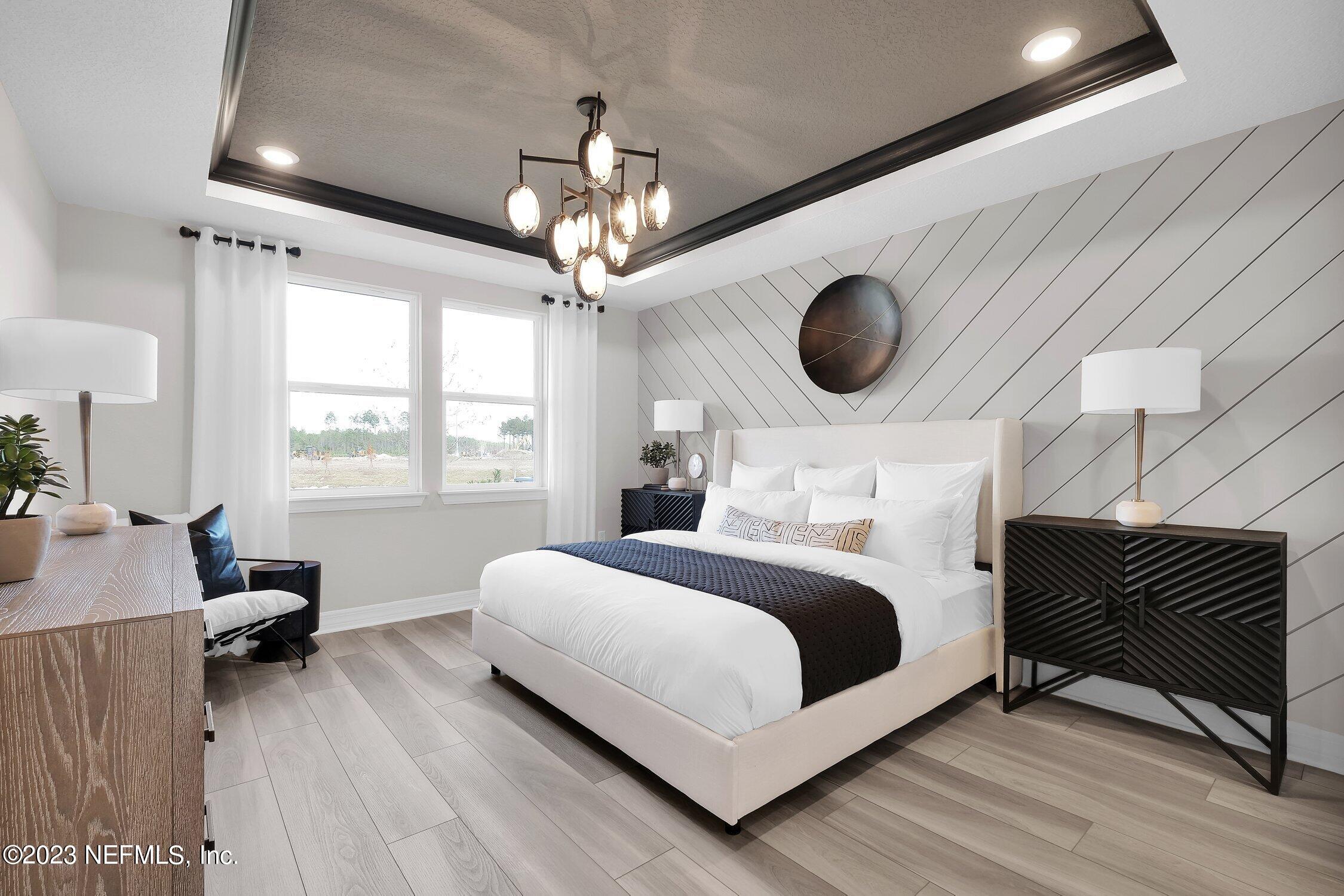 306 Shortleaf Lane Yulee, FL 32097 - Photo 17 of 35 a bedroom with a bed and a window