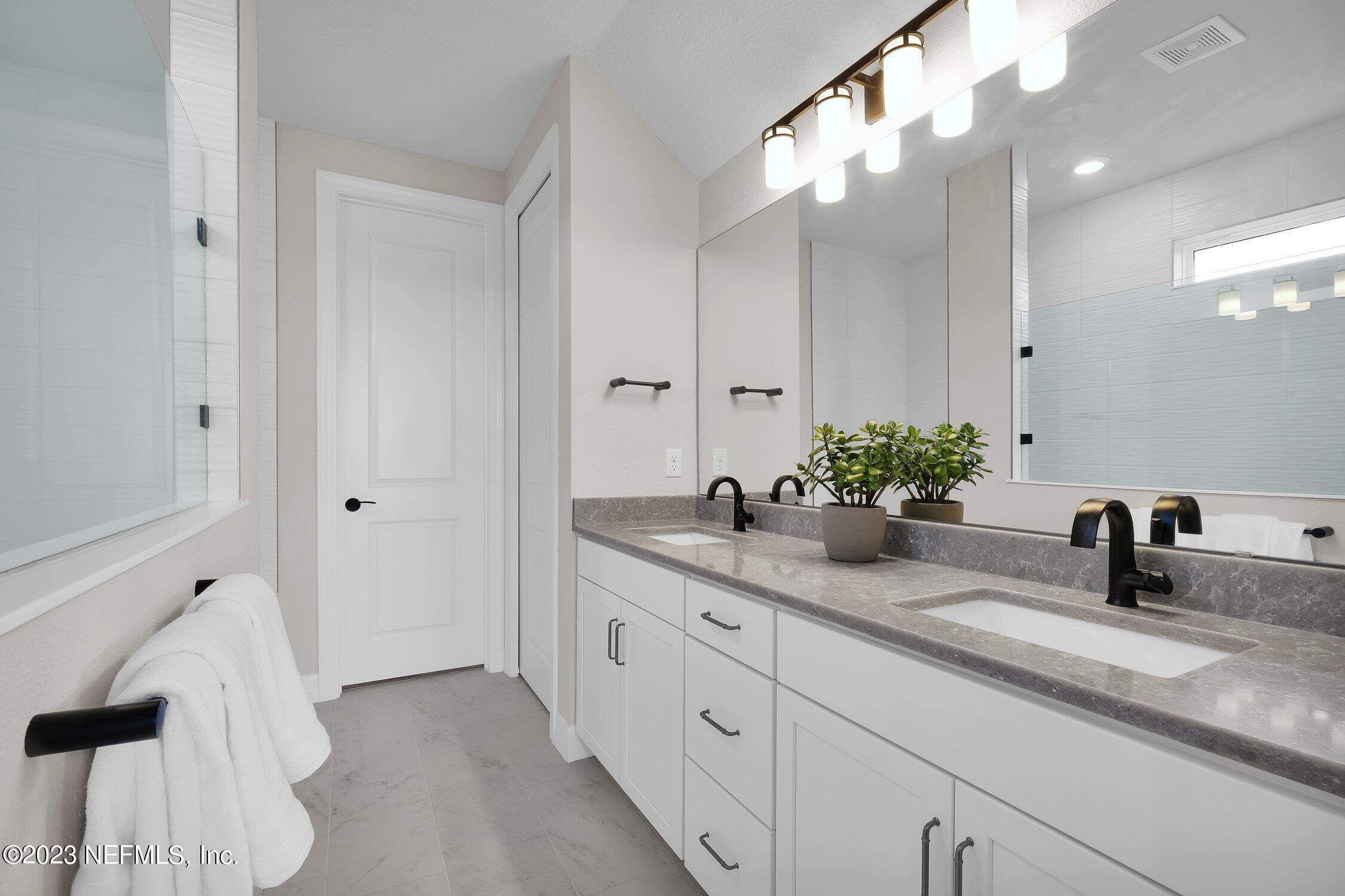 306 Shortleaf Lane Yulee, FL 32097 - Photo 19 of 35 a bathroom with a sink and a mirror