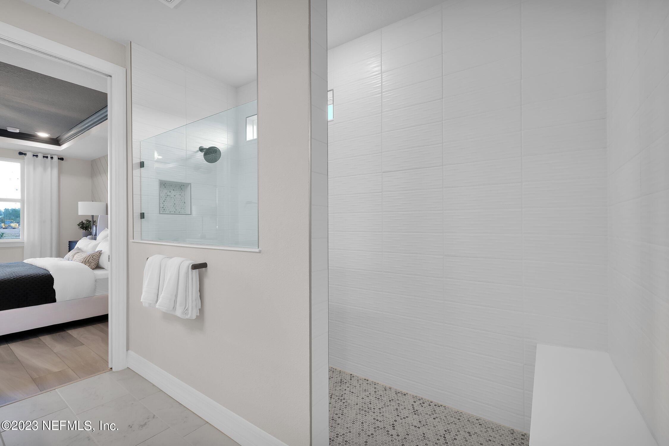 306 Shortleaf Lane Yulee, FL 32097 - Photo 20 of 35 a bathroom with a shower