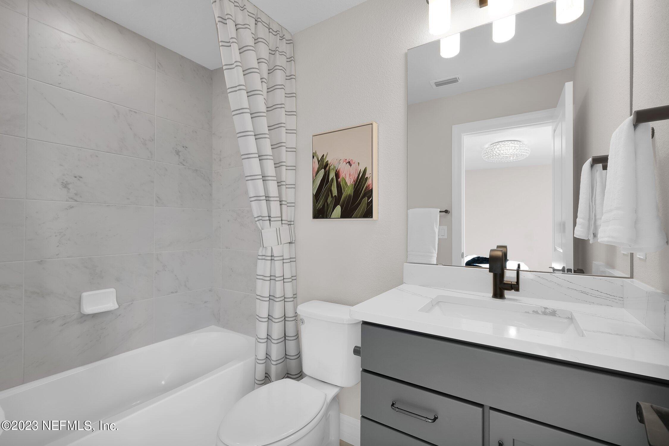 306 Shortleaf Lane Yulee, FL 32097 - Photo 25 of 35 a bathroom with a sink a toilet and shower