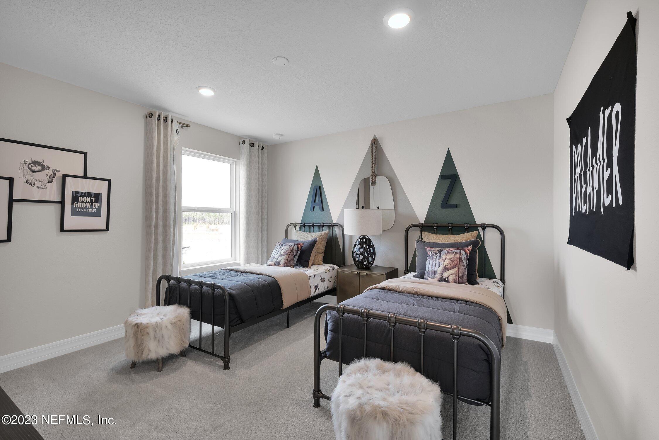 306 Shortleaf Lane Yulee, FL 32097 - Photo 28 of 35 a bedroom with two beds and a window