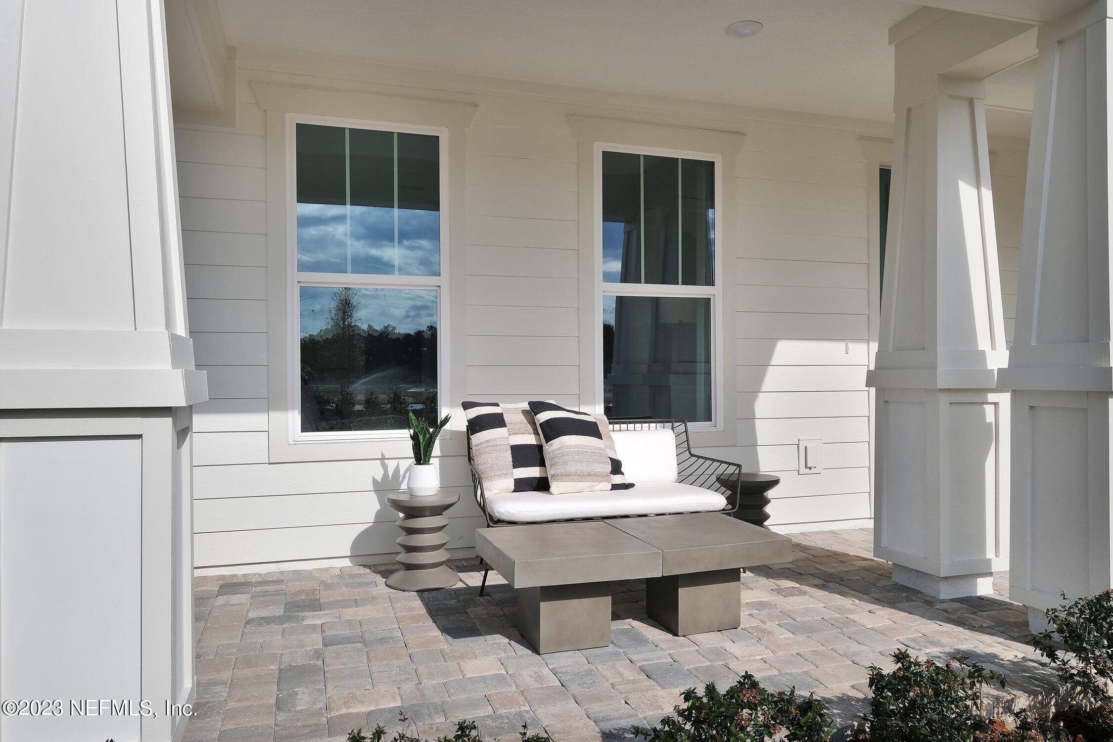 306 Shortleaf Lane Yulee, FL 32097 - Photo 5 of 35 a living room with furniture a window and a wooden floor