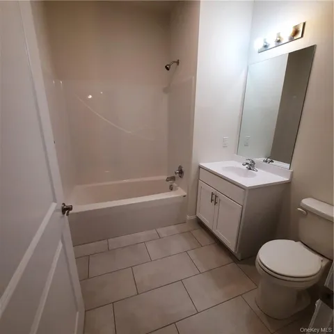 a view of a livingroom with wooden floor and staircase