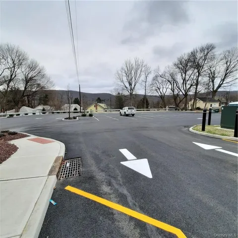 a view of a street with a building in the background