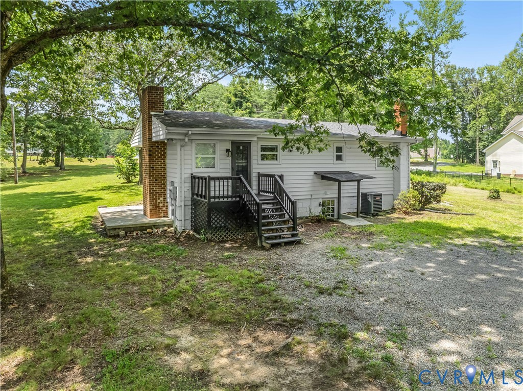 3179 Sandy Hook Road Sandy Hook, VA 23153 - Photo 1 of 36 a view of a house with backyard porch and sitting area