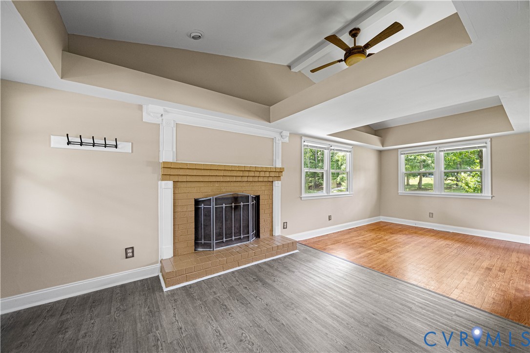 3179 Sandy Hook Road Sandy Hook, VA 23153 - Photo 14 of 36 an empty room with windows and fireplace