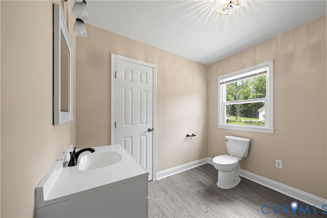 3179 Sandy Hook Road Sandy Hook, VA 23153 - Photo 20 of 36 a bathroom with a sink and a bathtub