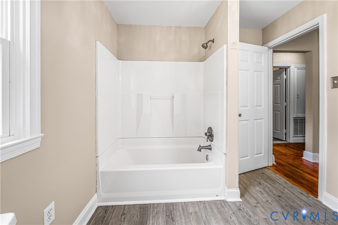 3179 Sandy Hook Road Sandy Hook, VA 23153 - Photo 21 of 36 a bathroom with a bathtub and a shower