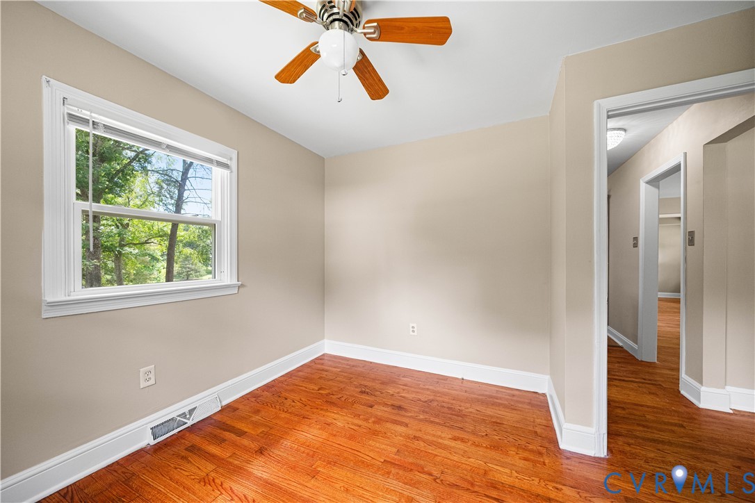 3179 Sandy Hook Road Sandy Hook, VA 23153 - Photo 22 of 36 a view of an empty room with wooden floor and a window