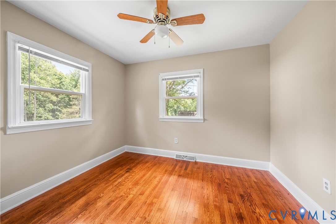 3179 Sandy Hook Road Sandy Hook, VA 23153 - Photo 24 of 36 a view of empty room with wooden floor and fan