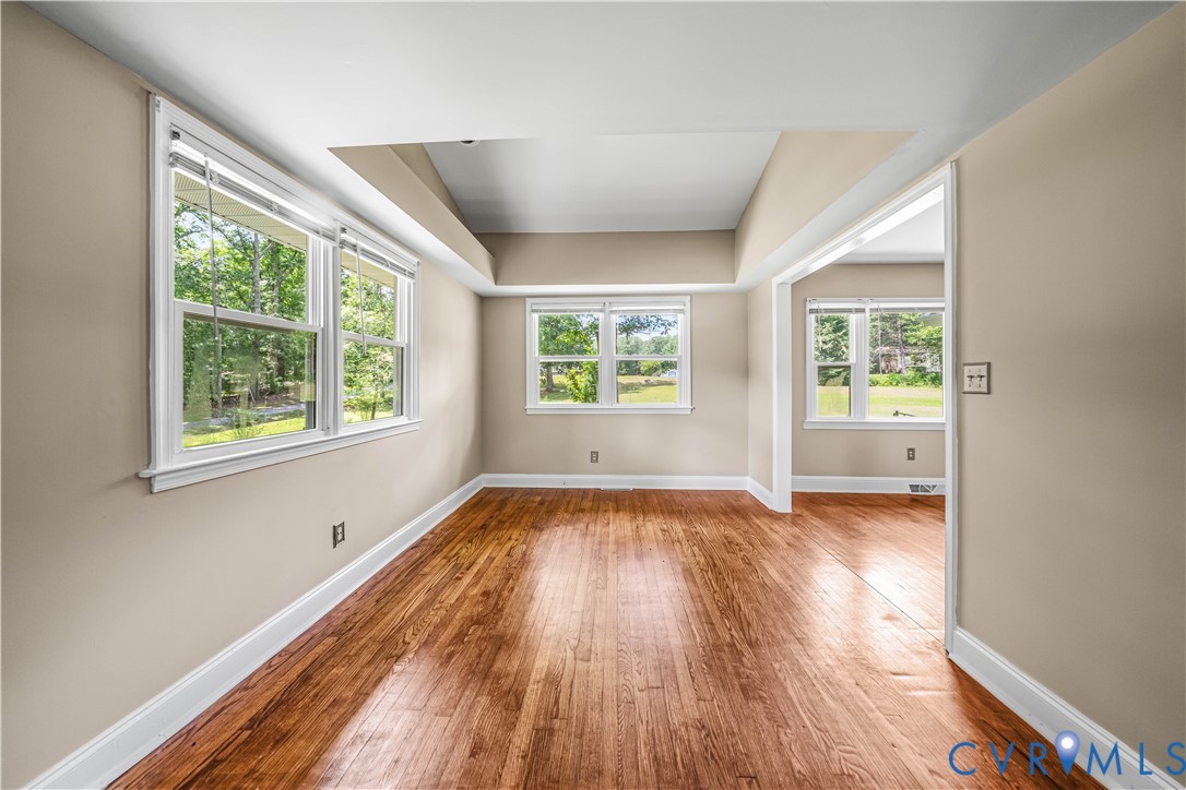 3179 Sandy Hook Road Sandy Hook, VA 23153 - Photo 34 of 36 a view of an empty room with wooden floor and a window