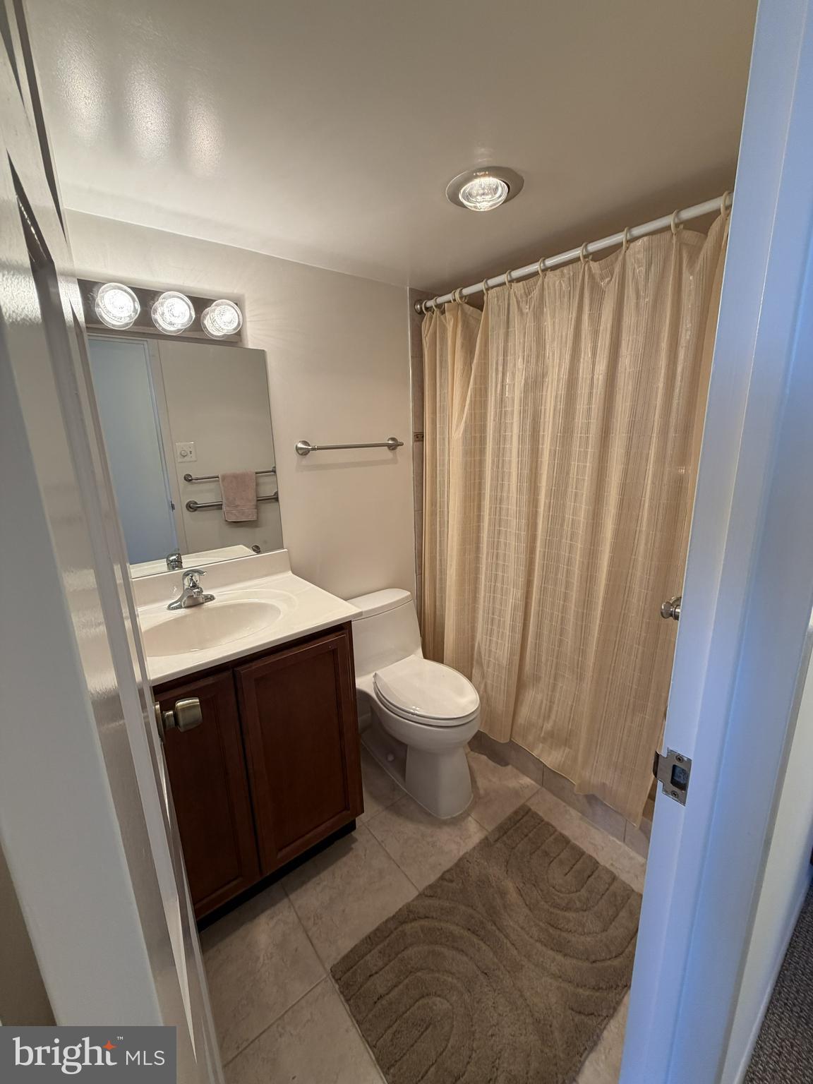 6800 Fleetwood Road, Unit 1002 McLean, VA 22101 - Photo 11 of 22 a bathroom with a sink and a mirror