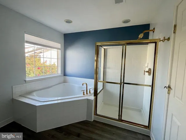 a white bath tub sitting next to a window