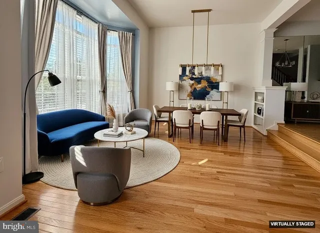a living room with fireplace furniture and a flat screen tv