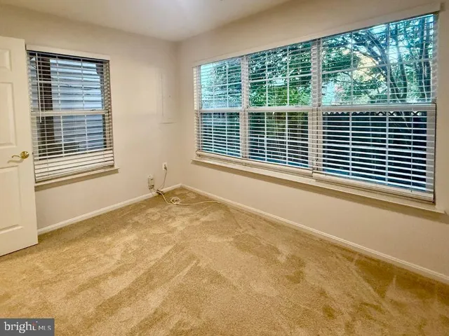 a view of a room with a large window
