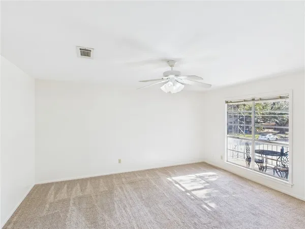 an empty room with a empty space and a window