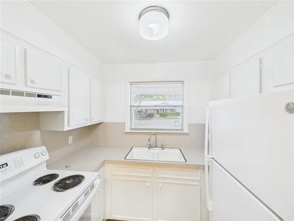 a view of kitchen and sink