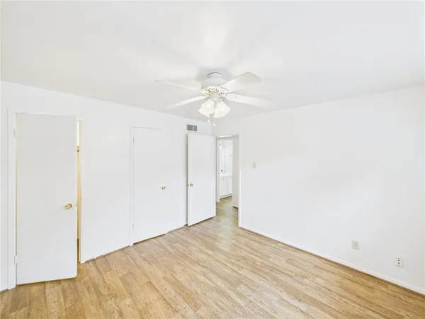 a view of a room with wooden floor